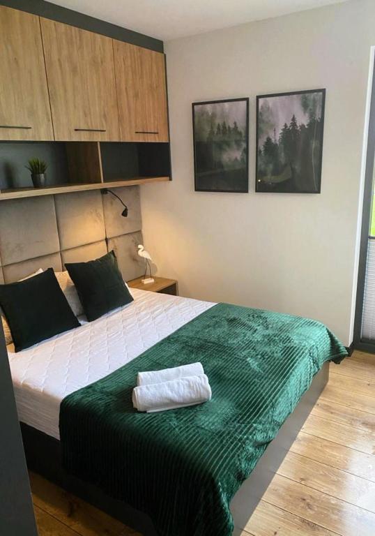 Posteľ alebo postele v izbe v ubytovaní CISZA Bungalows Village / Blisko Natury