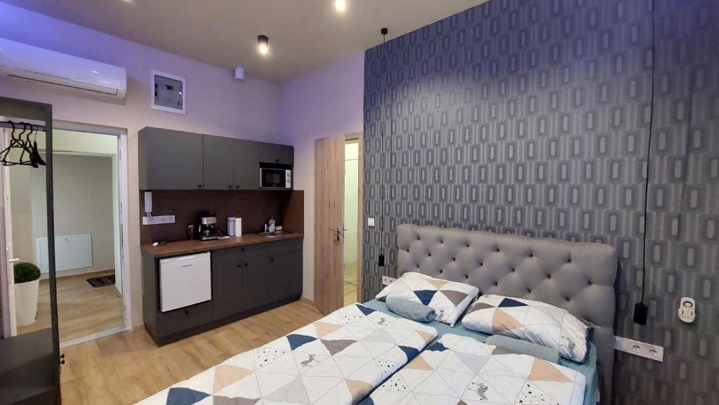 Postel nebo postele na pokoji v ubytování Földváry 3in1 Apartments