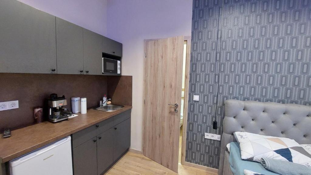 Kuchyň nebo kuchyňský kout v ubytování Földváry 3in1 Apartments