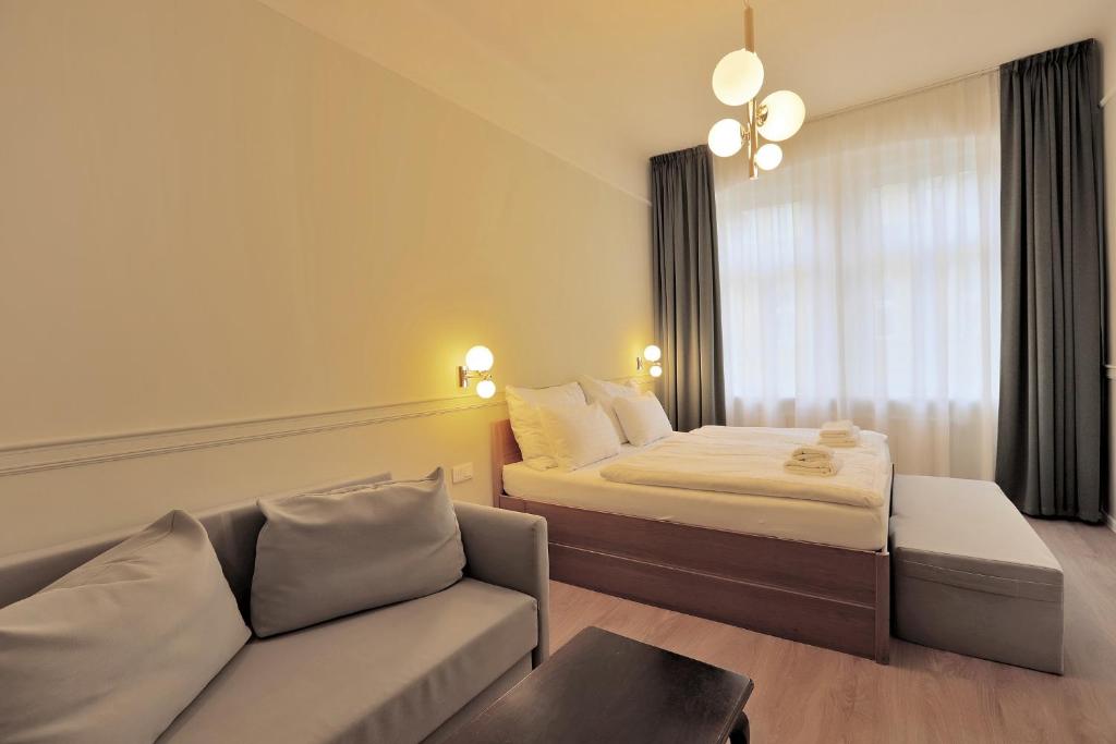 Postel nebo postele na pokoji v ubytování Kavalír Apartments