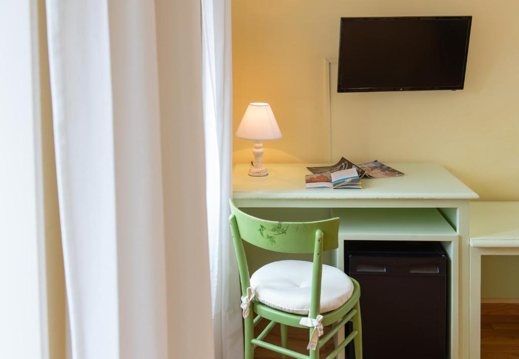 TV a/nebo společenská místnost v ubytování Hotel Minerva