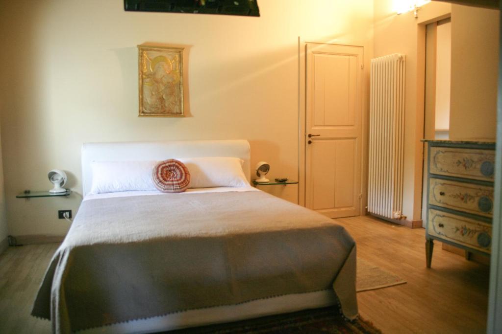 Postel nebo postele na pokoji v ubytování B&B Il Poggio di Gavi