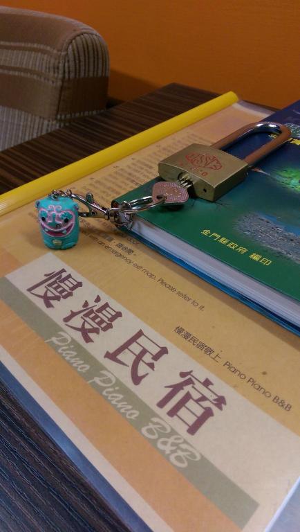 a book with a key on top of it at PianoPiano B&amp;B in Jincheng