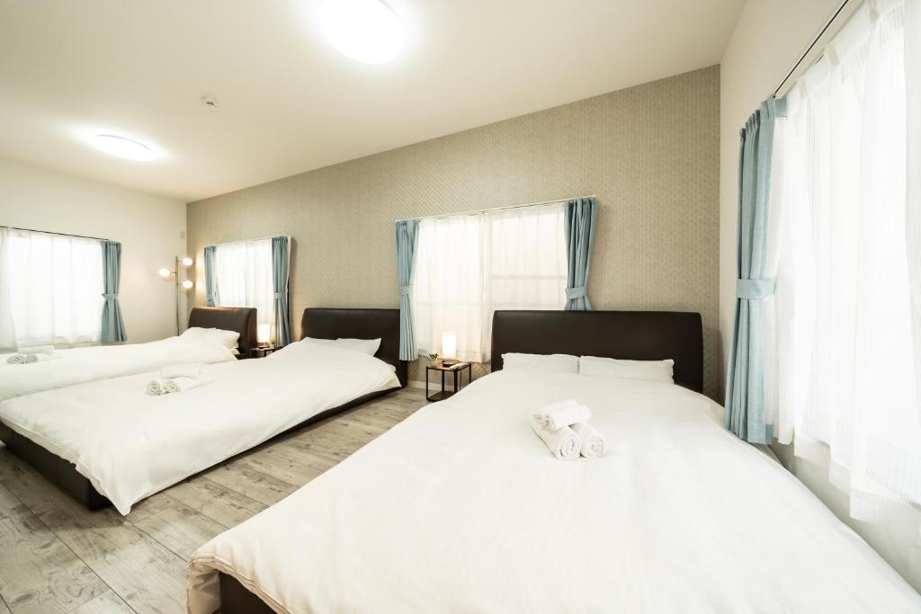 Postel nebo postele na pokoji v ubytování 23, Midoricho, Private house rental