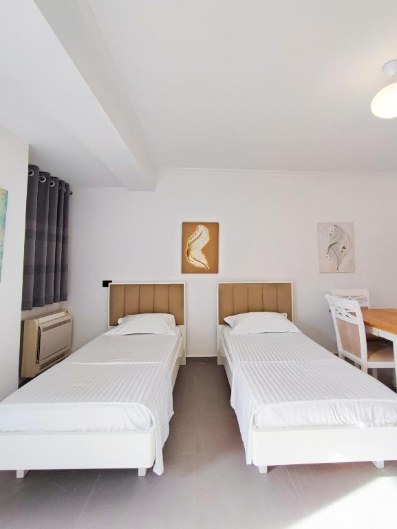 Postel nebo postele na pokoji v ubytování Comfort Villa