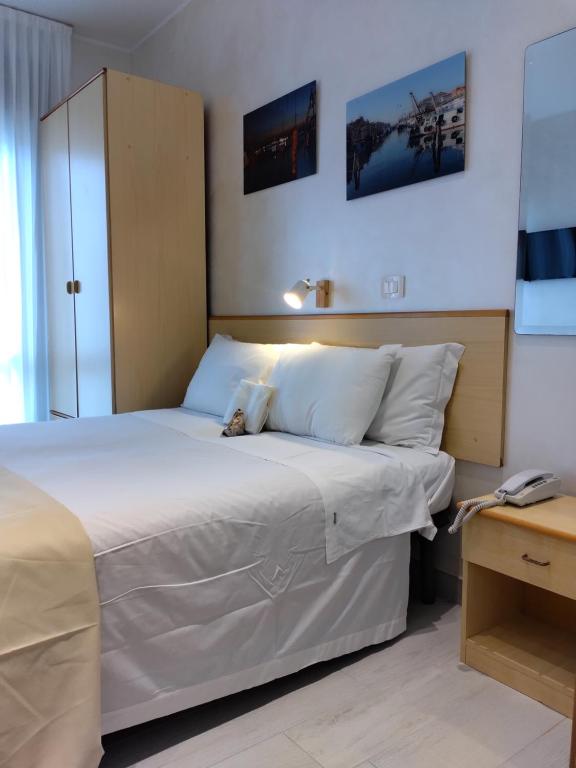 Postel nebo postele na pokoji v ubytování Hotel Baviera