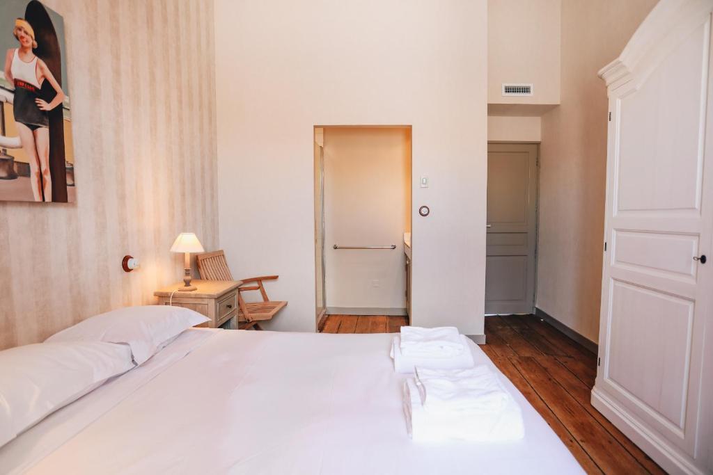 Łóżko lub łóżka w pokoju w obiekcie Villa Petit Sergent