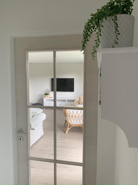 a room with a sliding glass door with a living room at FerienChata Bärenriegel in Arrach