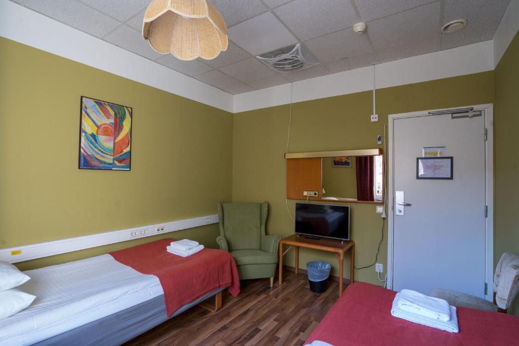 Postel nebo postele na pokoji v ubytování Reimersholme Hotel