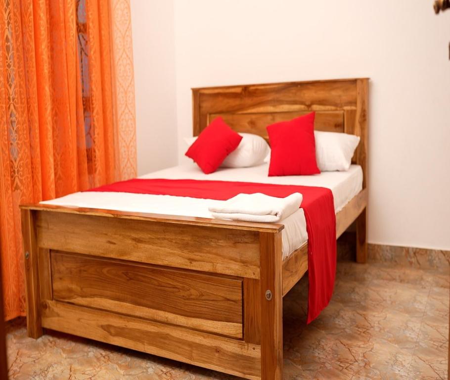 Postel nebo postele na pokoji v ubytování PKV Trinco Villas
