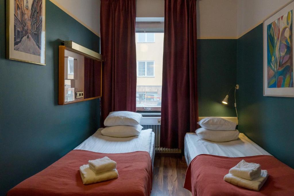 Postel nebo postele na pokoji v ubytování Reimersholme Hotel