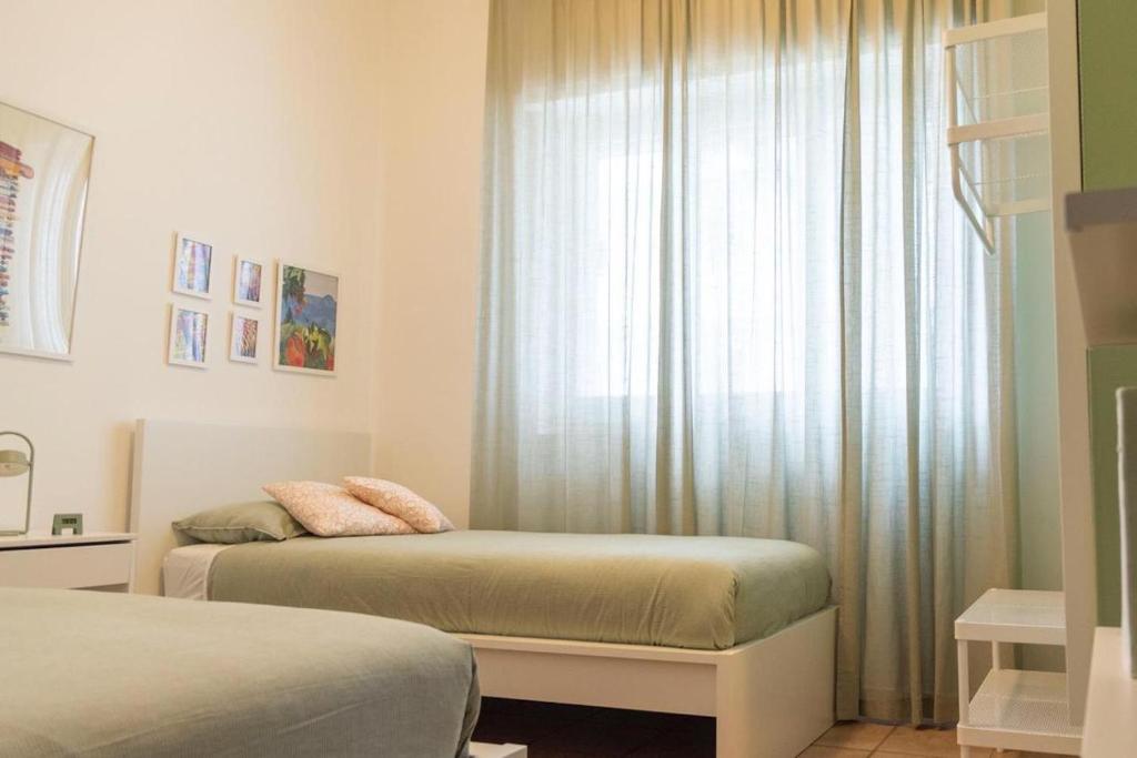 Posteľ alebo postele v izbe v ubytovaní Blu Sun Apartment in Complesso Riva del Sole