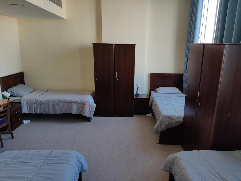 Postel nebo postele na pokoji v ubytování Oasis Hostel