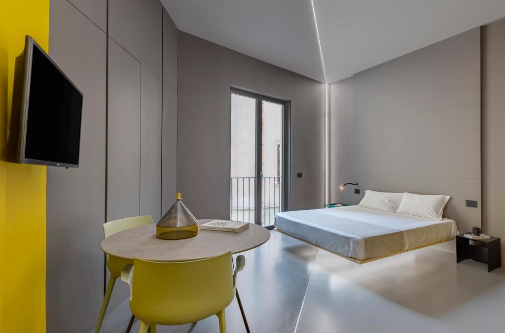Postel nebo postele na pokoji v ubytování Fiveplace Design Suites & Apartments