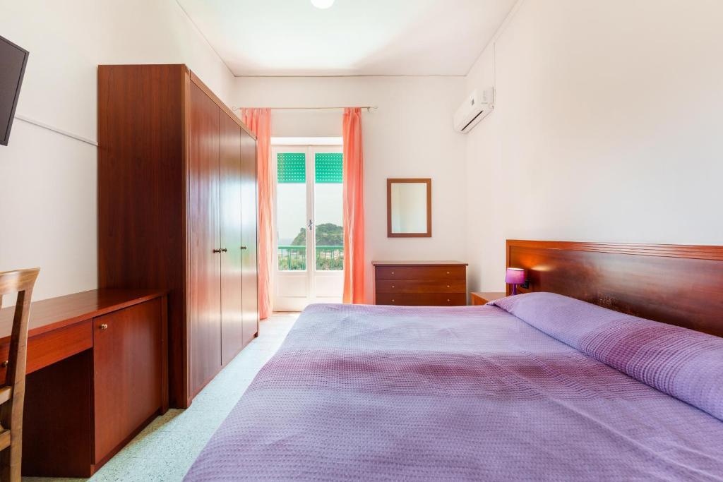 Postel nebo postele na pokoji v ubytování Hotel Riviera