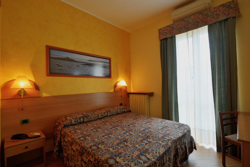Postel nebo postele na pokoji v ubytování Hotel Eden