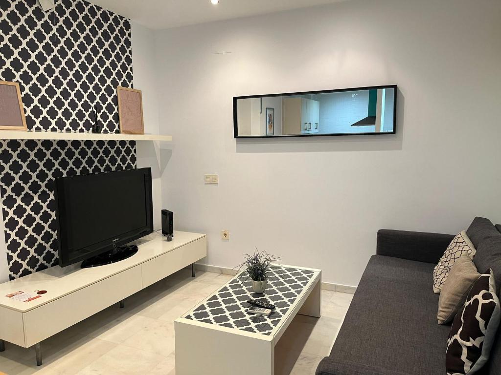 TV a/nebo společenská místnost v ubytování La Piccola Cadiz