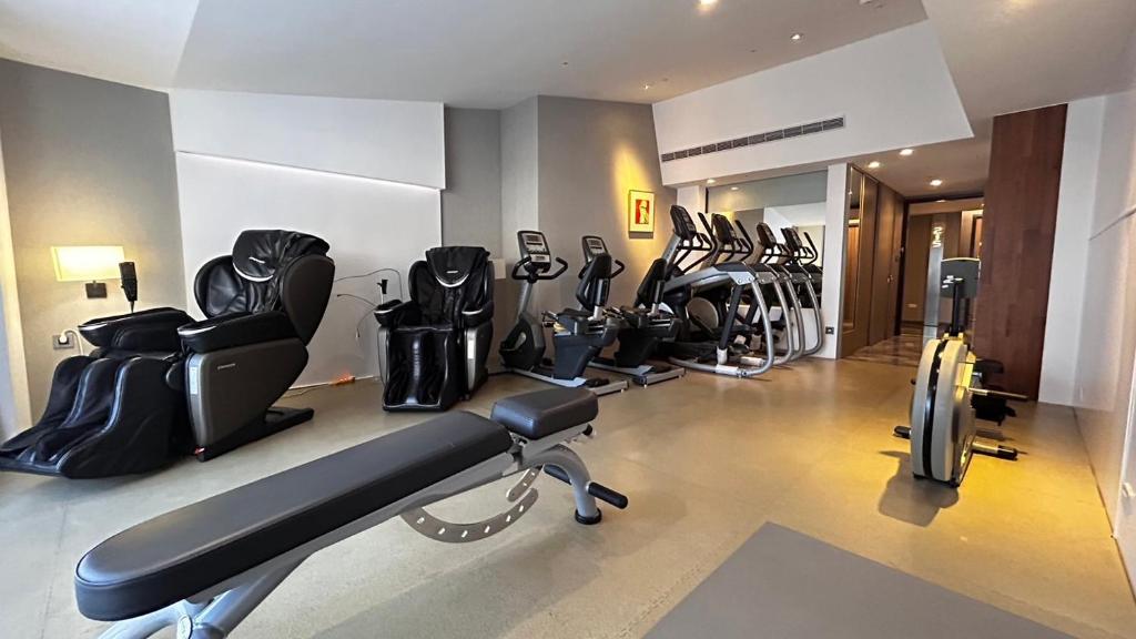 a gym with a bunch of exercise equipment in a room at Volando Kenting in Hengchun