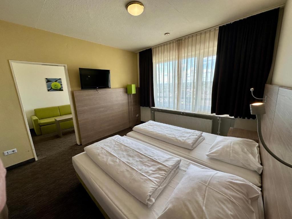 Postel nebo postele na pokoji v ubytování Gästehaus Fernblick