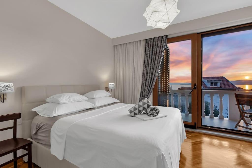 a bedroom with a large white bed and a large window at Villa Markota!200m from the SEA! - Makarska Exklusiv in Promajna