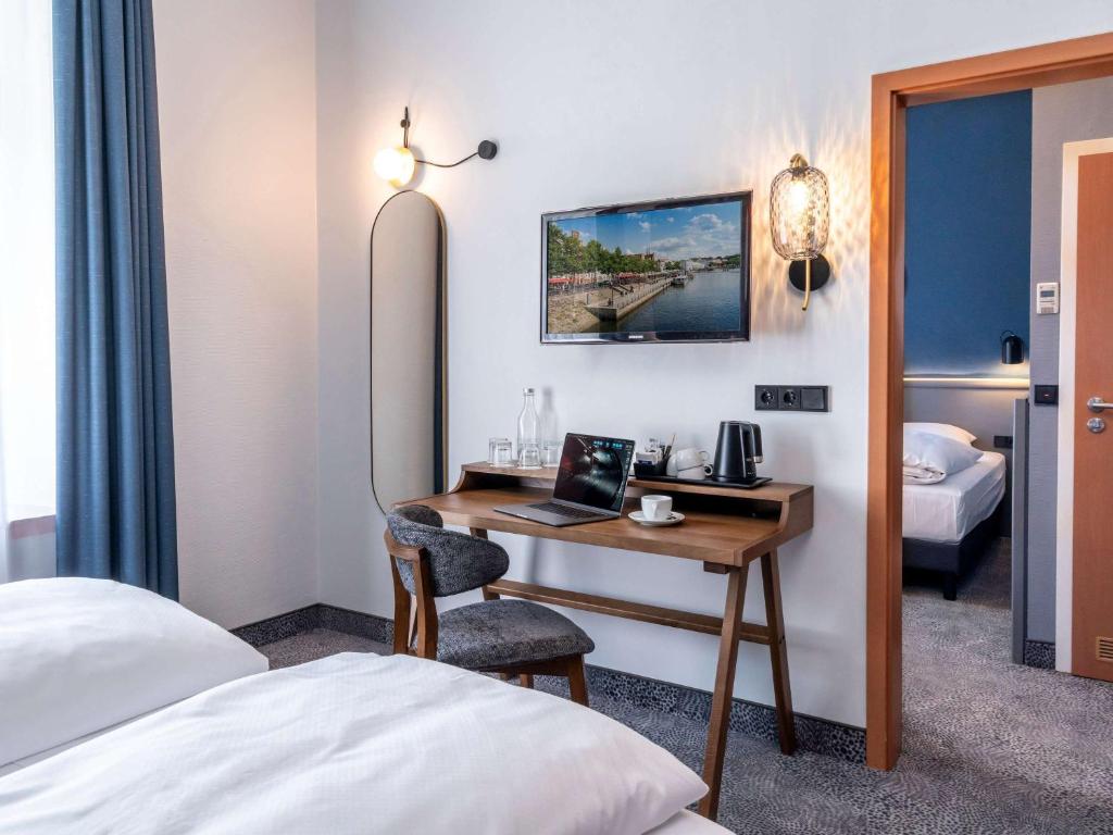 Postel nebo postele na pokoji v ubytování Mercure Hotel Luebeck City Center