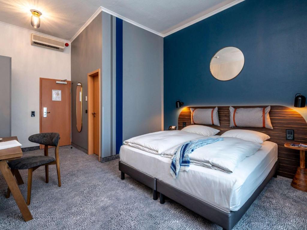 Postel nebo postele na pokoji v ubytování Mercure Hotel Luebeck City Center