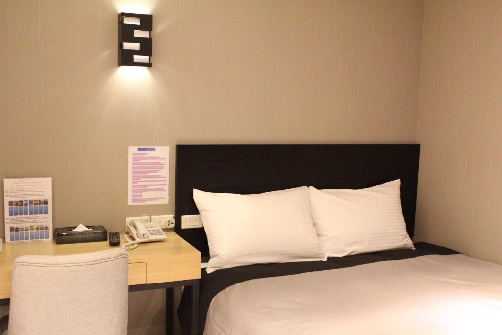 Postel nebo postele na pokoji v ubytování E-House Xining Branch