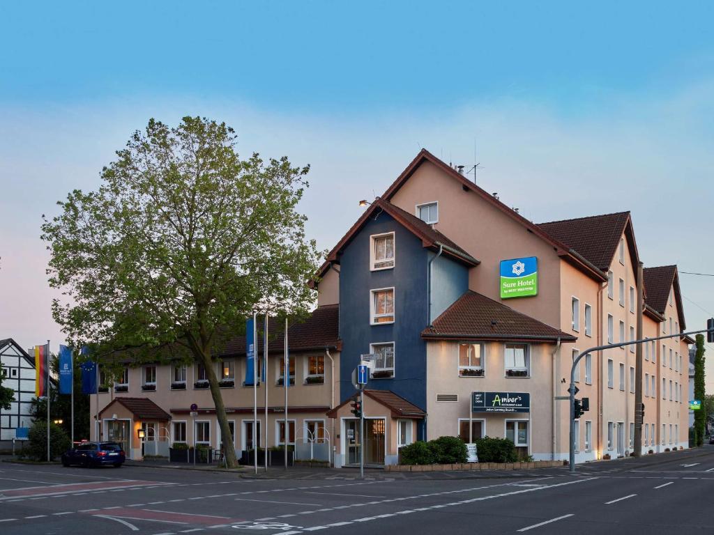 a building on the side of a street at Sure Hotel by Best Western Hilden-Düsseldorf in Hilden