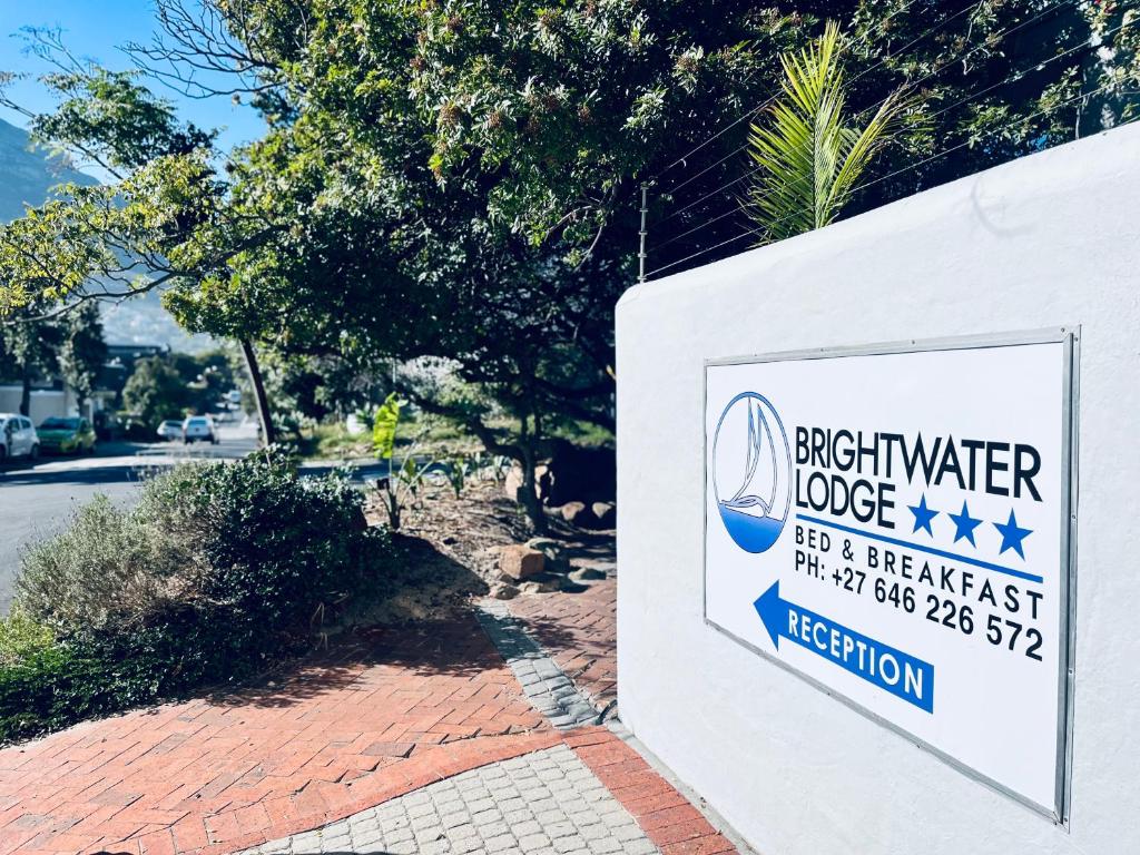 a sign for a bushker house on a street at Brightwater Lodge in Hout Bay