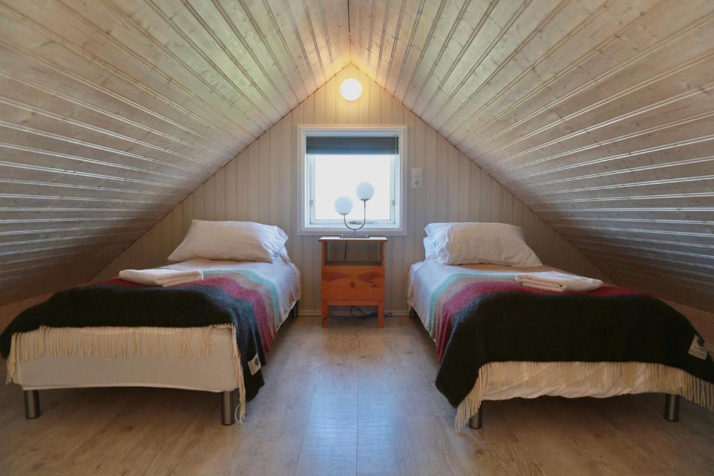 Postel nebo postele na pokoji v ubytování Eldhraun Holiday Home