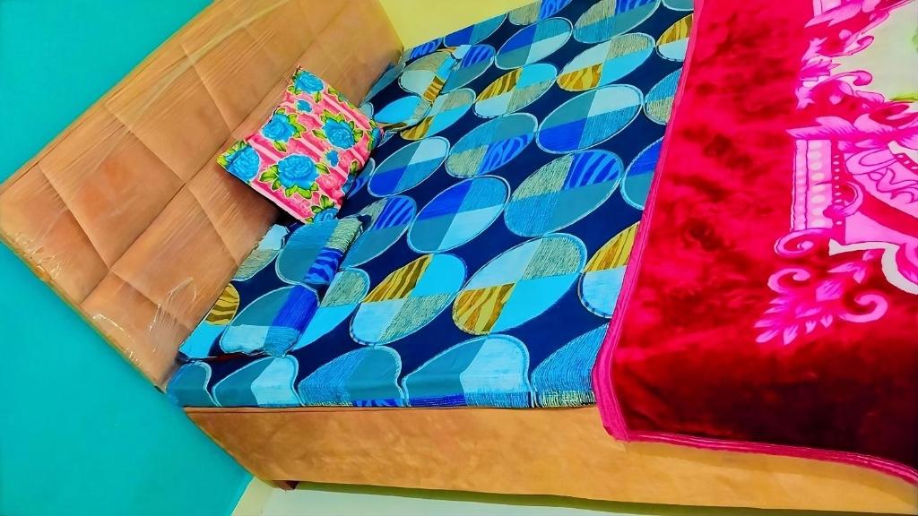 a wooden box with a napkin on top at Shree Hatkeshwar Home Stay Ujjain in Ujjain