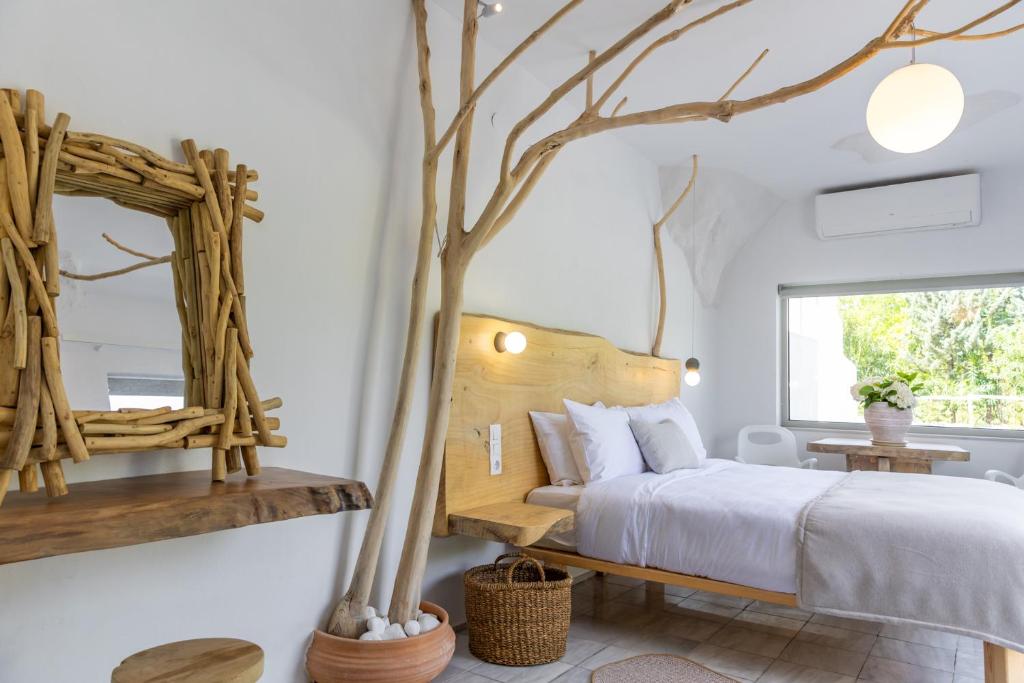 Postel nebo postele na pokoji v ubytování Olympa Suites
