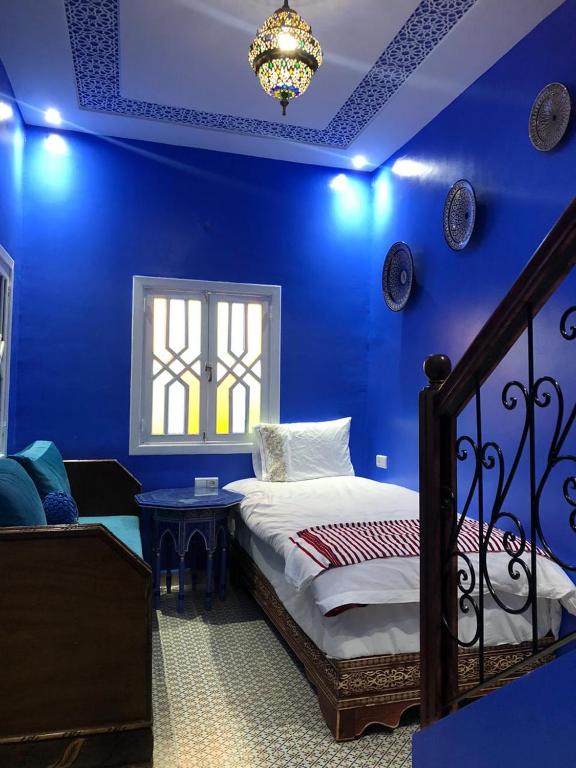 Un ou plusieurs lits dans un hébergement de l'établissement RIAD CHENGLI 蓝城里