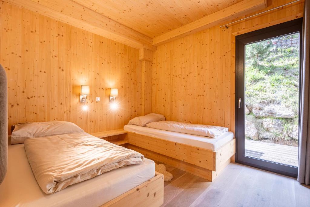 Posteľ alebo postele v izbe v ubytovaní Alpenchalets Reiteralm by ALPS RESORTS