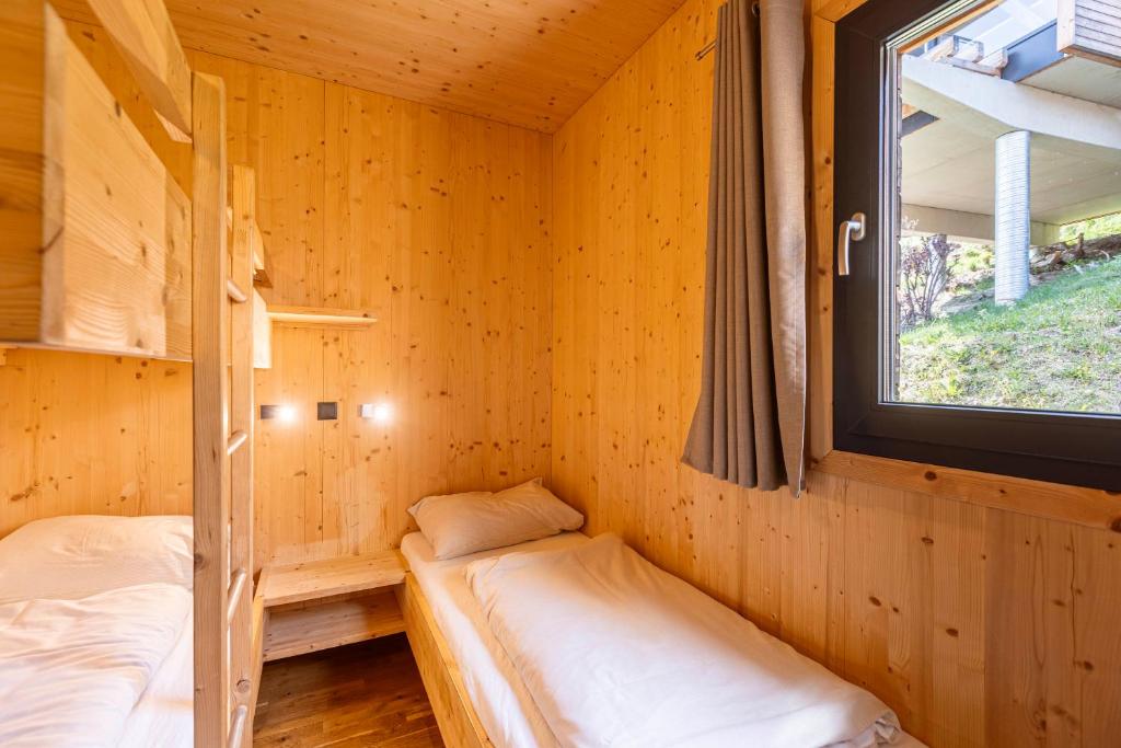 Posteľ alebo postele v izbe v ubytovaní Alpenchalets Reiteralm by ALPS RESORTS