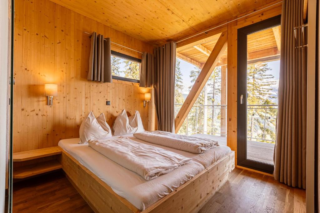 Posteľ alebo postele v izbe v ubytovaní Alpenchalets Reiteralm by ALPS RESORTS