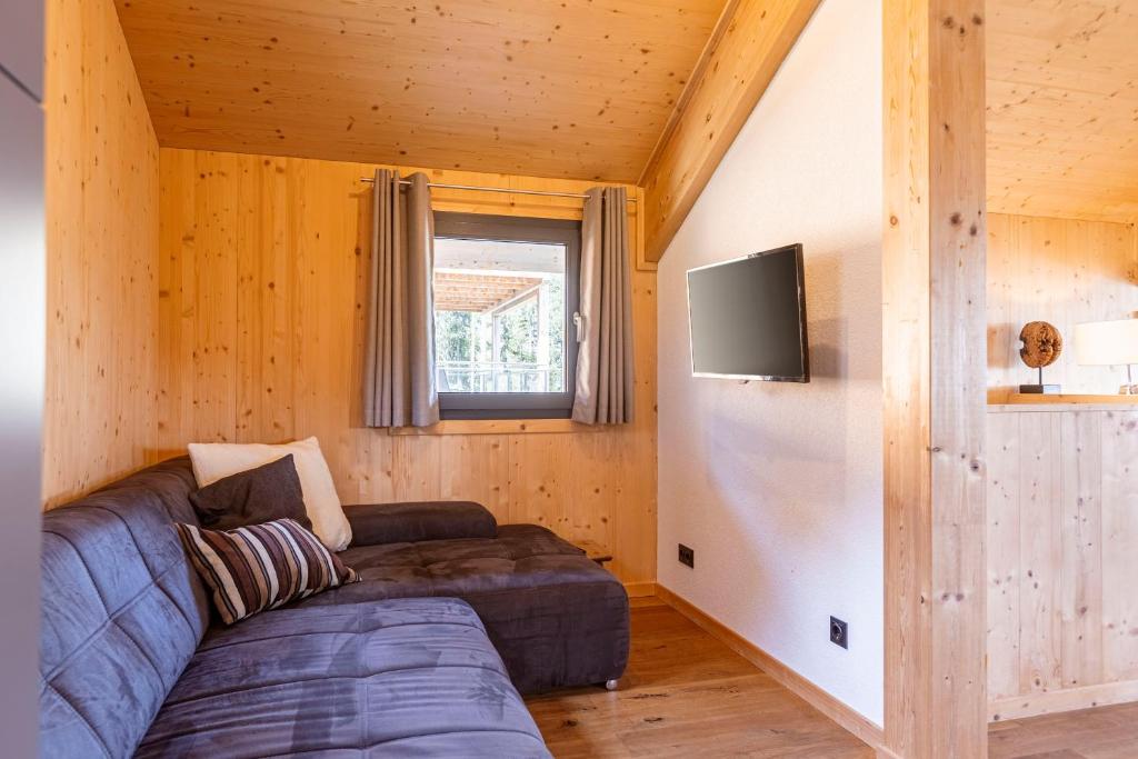 Televízia a/alebo spoločenská miestnosť v ubytovaní Alpenchalets Reiteralm by ALPS RESORTS