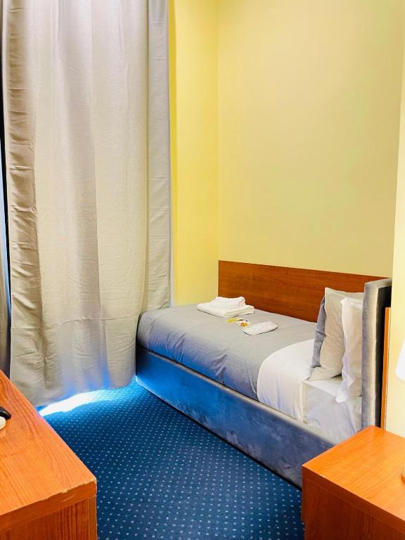 Postel nebo postele na pokoji v ubytování Hotel Rome place