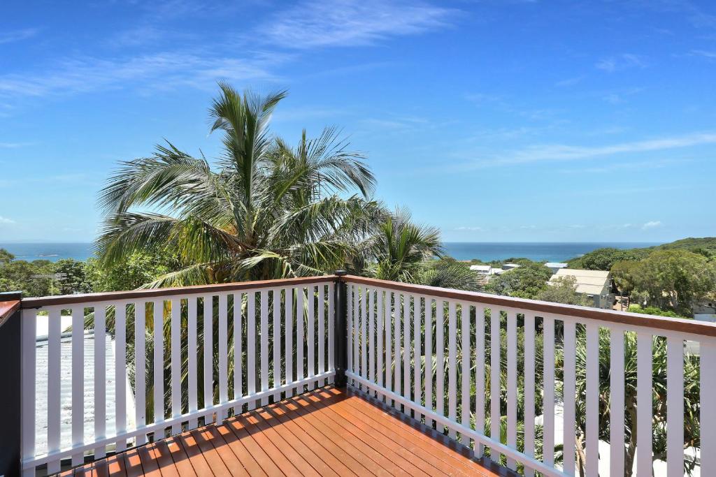 a balcony with a view of the ocean at Cylinder Palms in Point Lookout