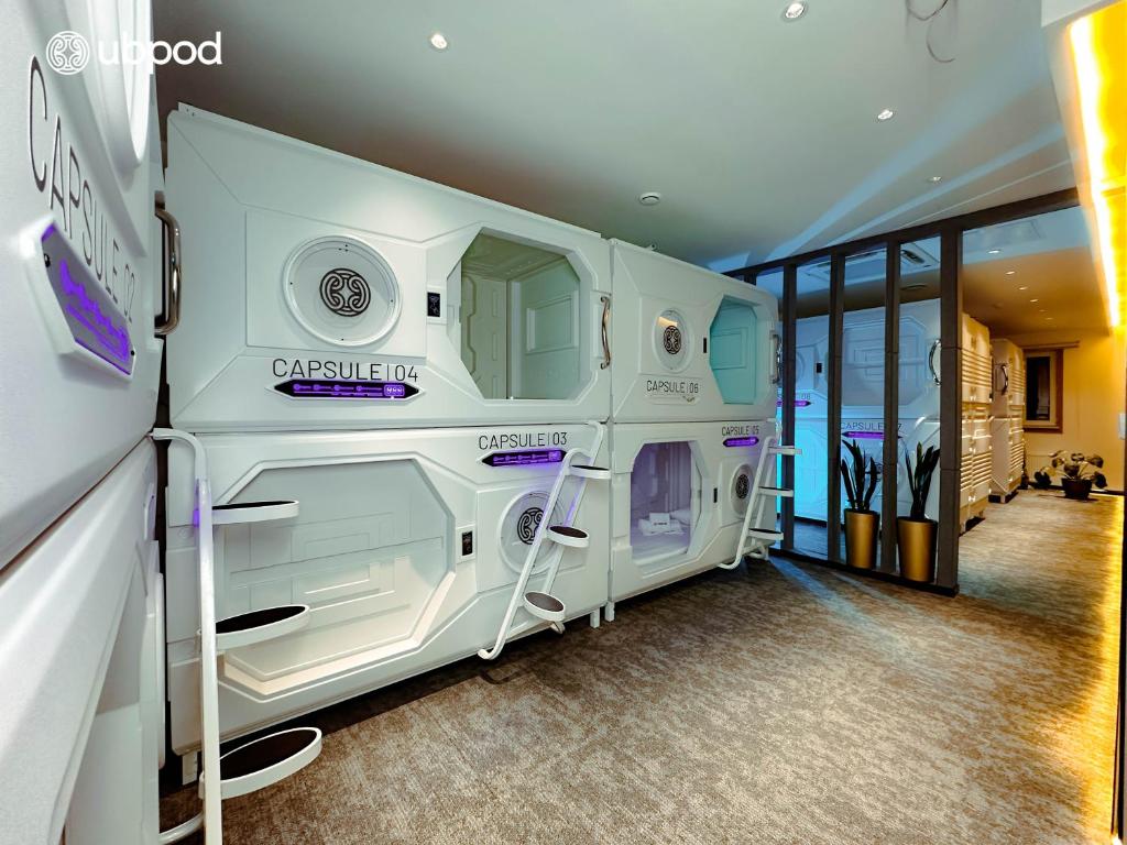 a room with a large white room with a room at UBPOD- The First Capsule Hotel in Mongolia in Ulaanbaatar
