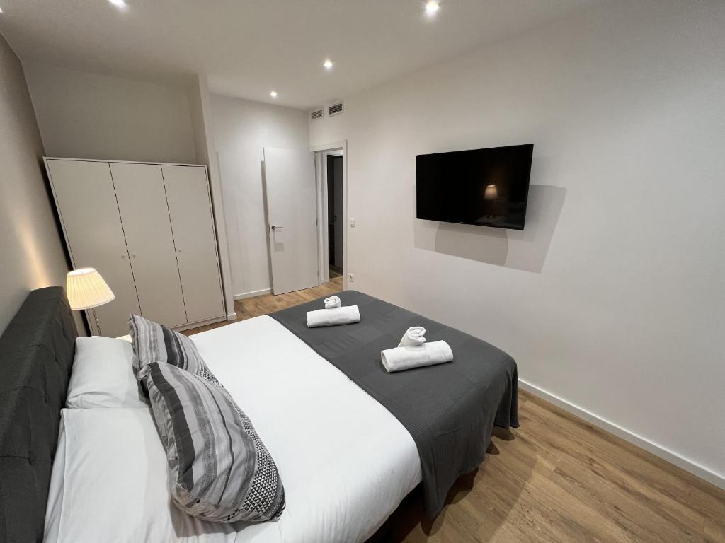 Postel nebo postele na pokoji v ubytování Apartamenticos Plaza Las Armas III
