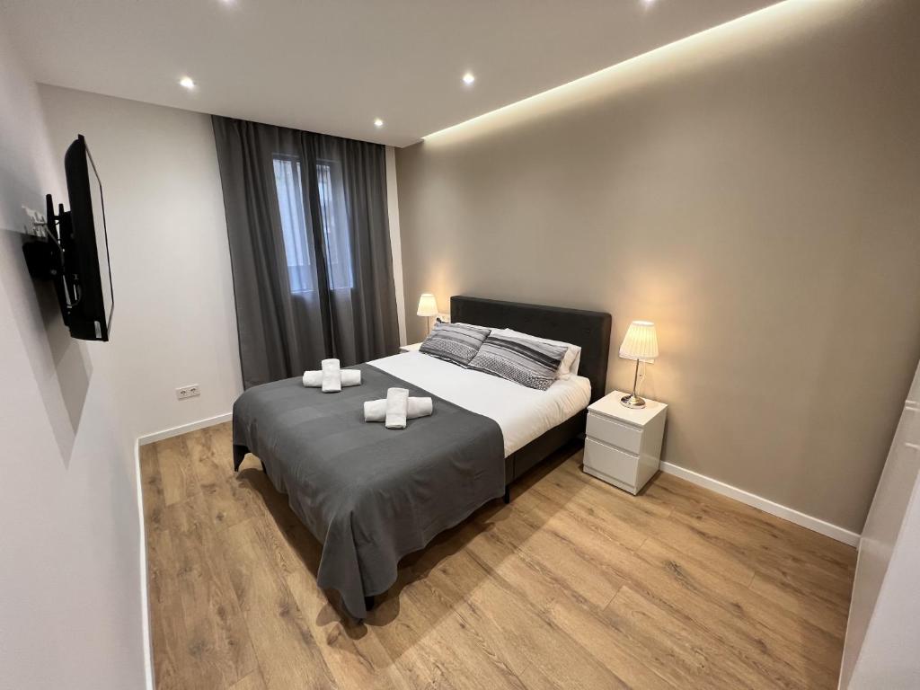 Postel nebo postele na pokoji v ubytování Apartamenticos Plaza Las Armas III