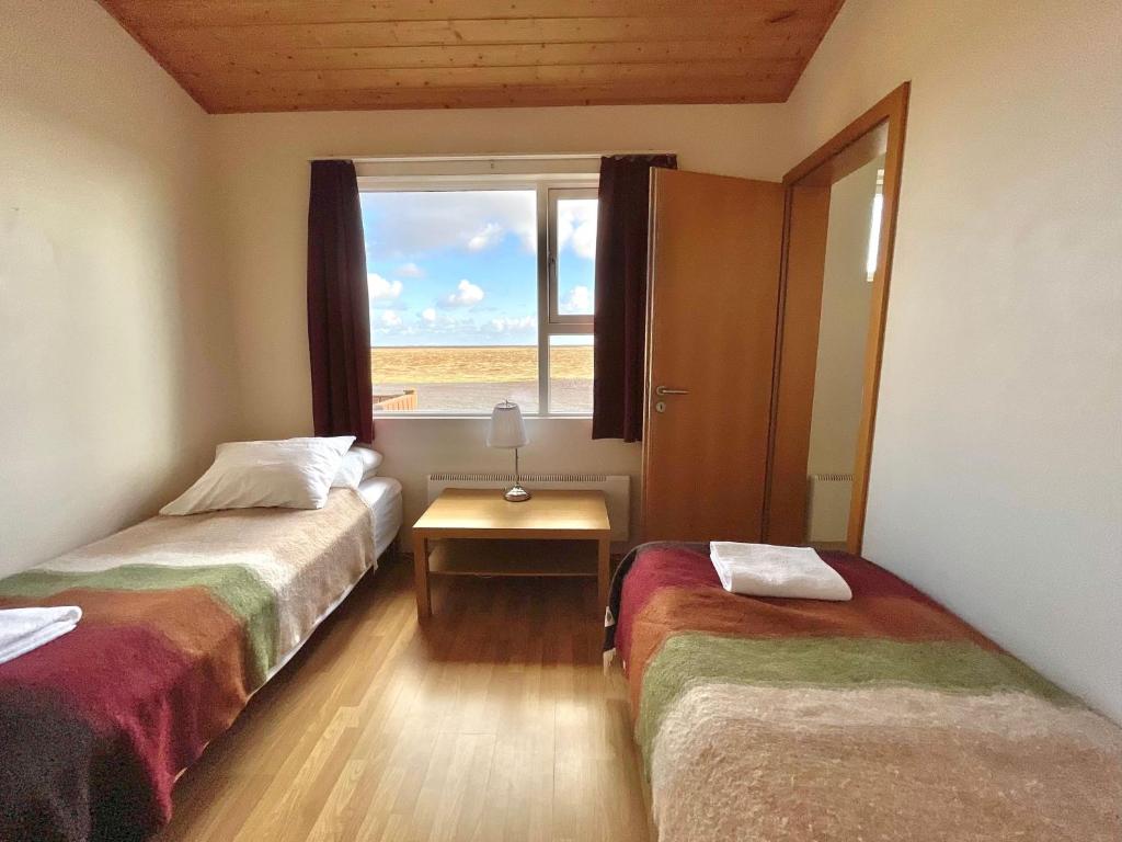 Postel nebo postele na pokoji v ubytování Eldhraun Holiday Home