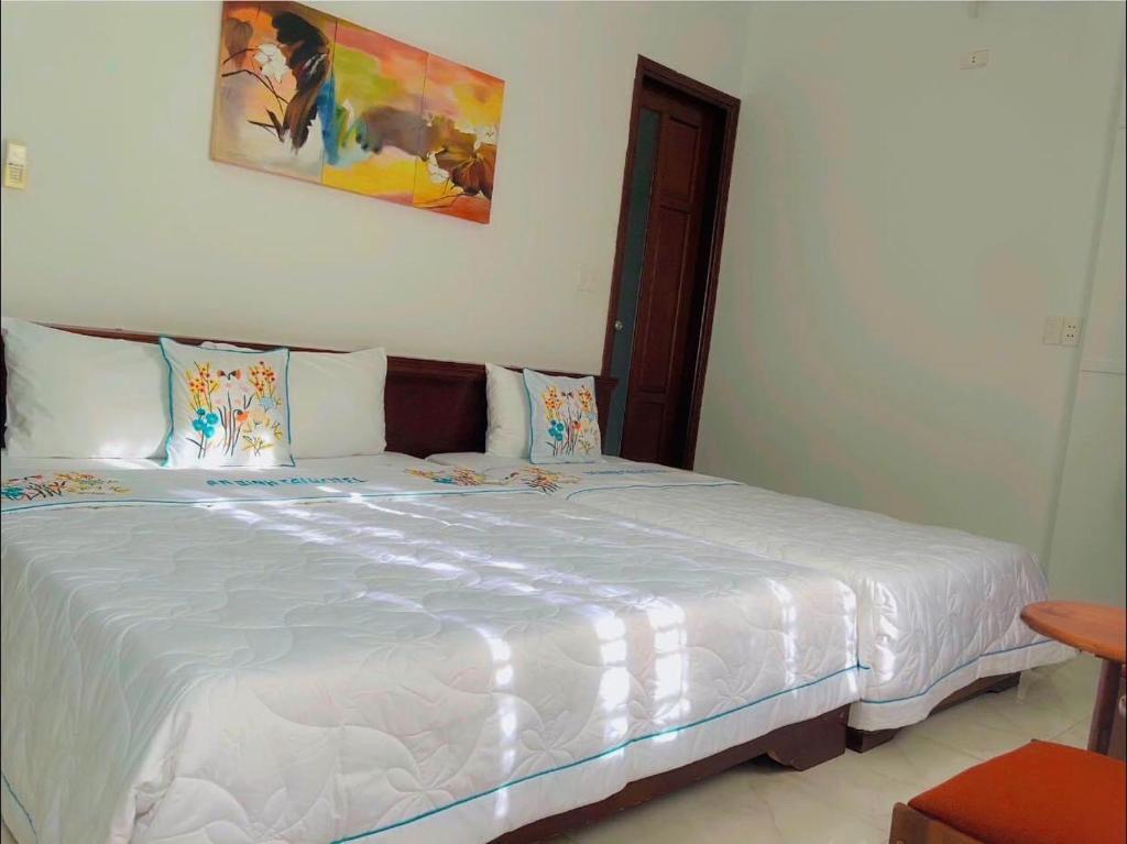 Postel nebo postele na pokoji v ubytování An Bình Tài Hotel