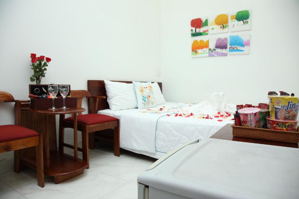 Postel nebo postele na pokoji v ubytování An Bình Tài Hotel