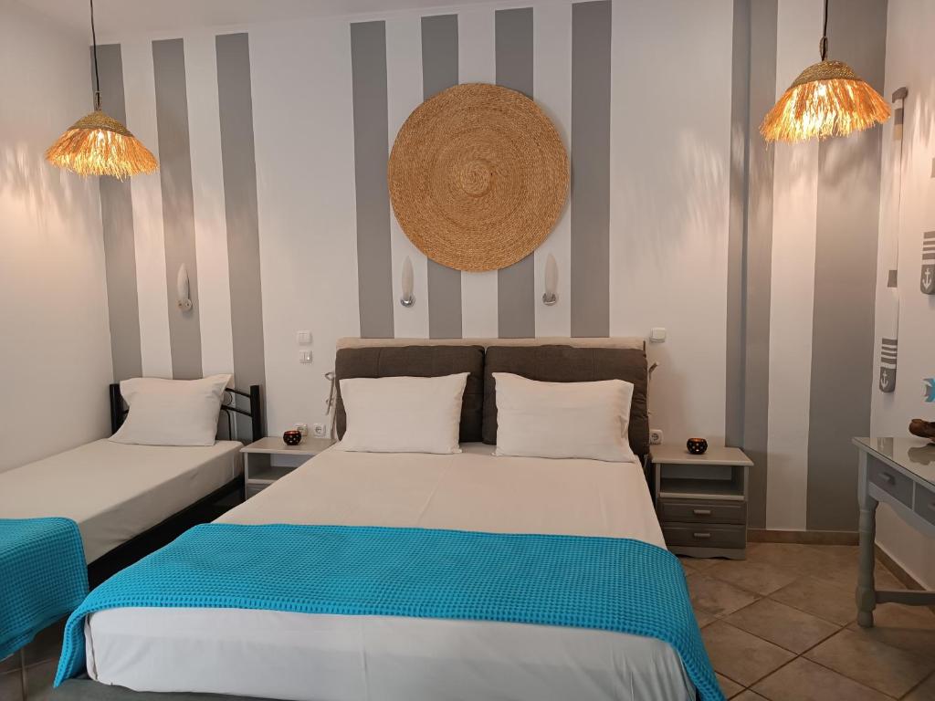 Postel nebo postele na pokoji v ubytování Ilios studios