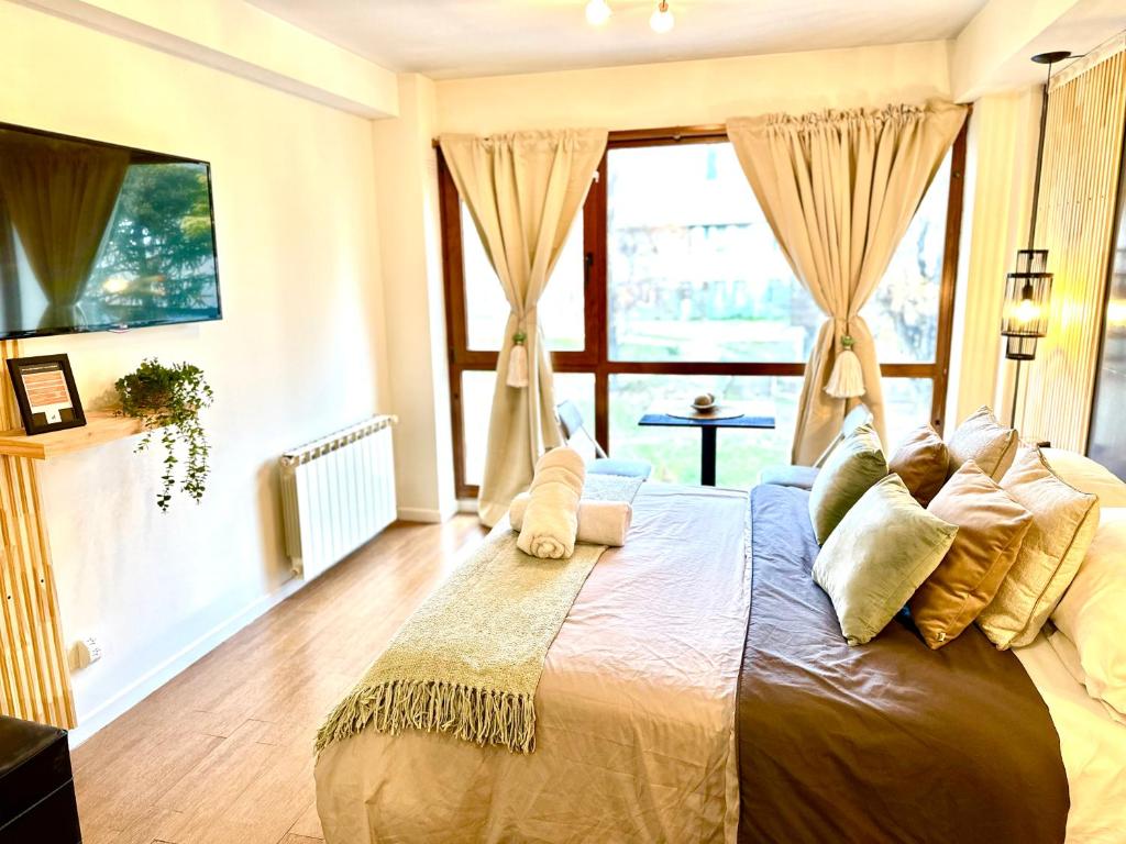 Postel nebo postele na pokoji v ubytování BlackBird Moreno1