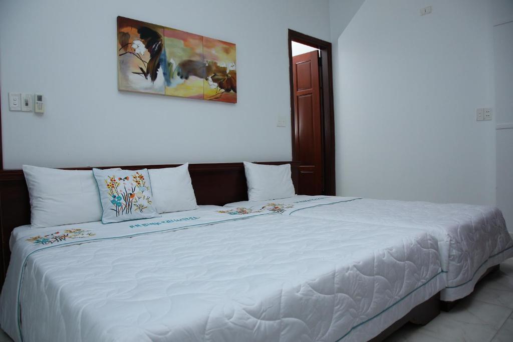 Postel nebo postele na pokoji v ubytování An Bình Tài Hotel