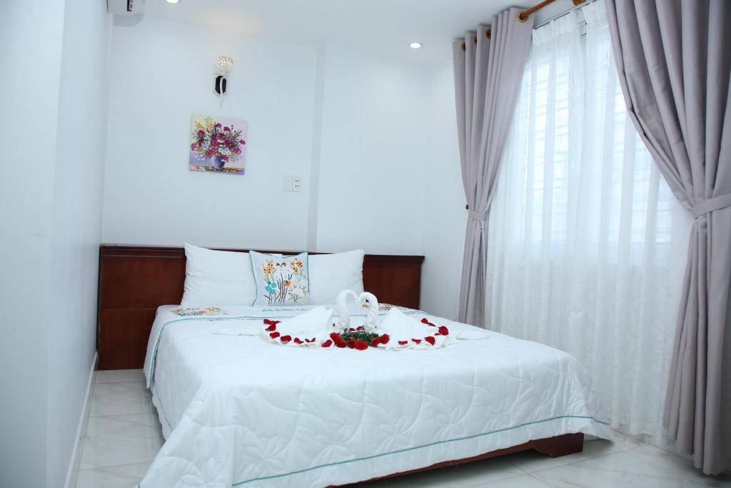 Postel nebo postele na pokoji v ubytování An Bình Tài Hotel