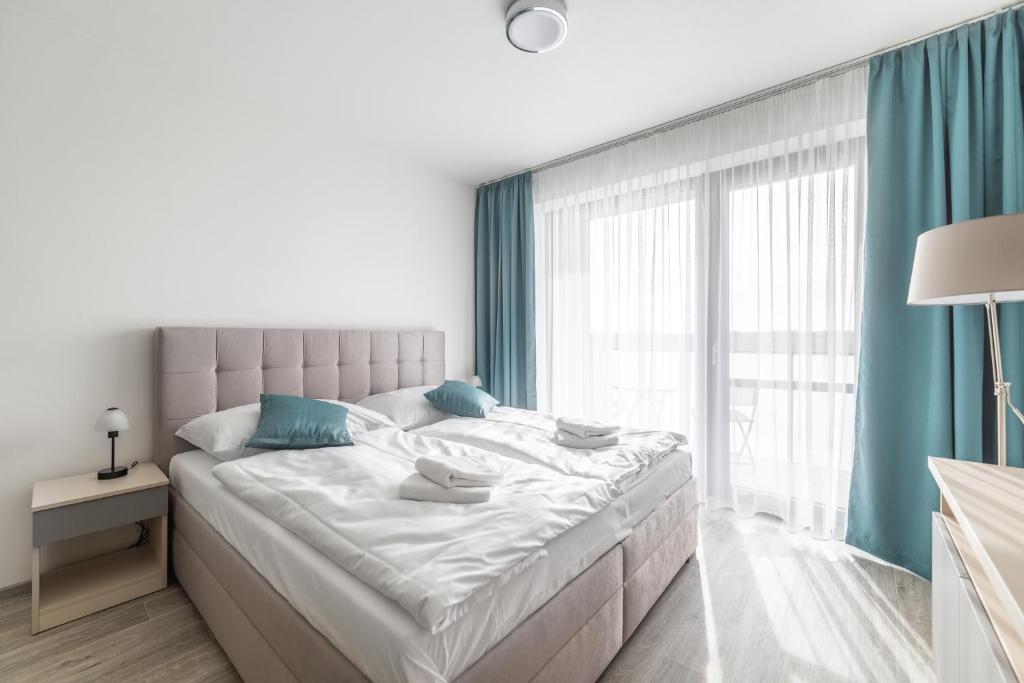 Łóżko lub łóżka w pokoju w obiekcie RELAX PARK Třeboň II